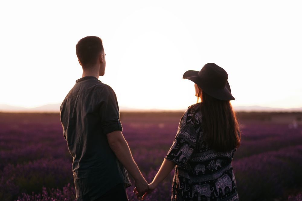 Young couple on a romantic date in a lavender field.