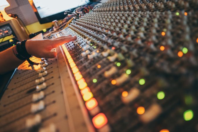 Man in a equalizer instrument in a studio