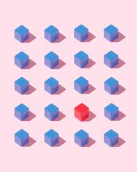 Many blue cubes and one red cube on pink background