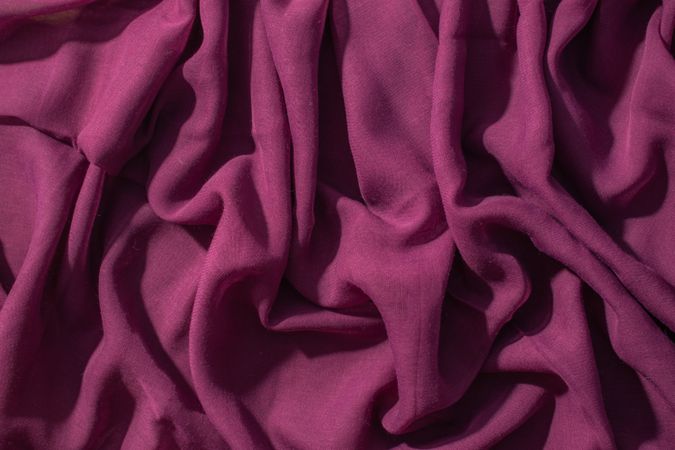 Soft purple fabric wavy crumpled background abstract.