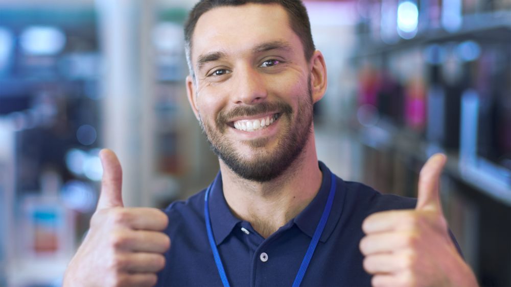Portrait of a Professional Consultant Smiling and Giving Thumbs Up in the Bright