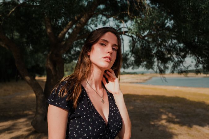 Woman with long hair standing near seaside