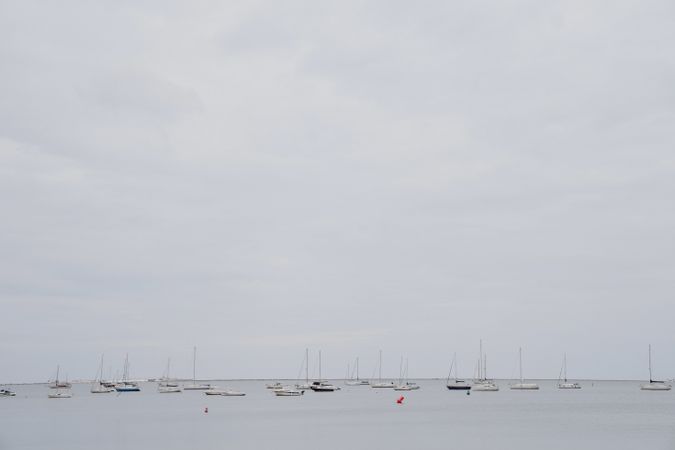 Yachts against overcast sky