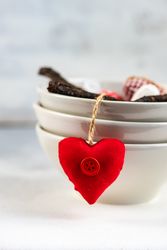 St. Valentines Day concept with heart decoration hanging off bowl