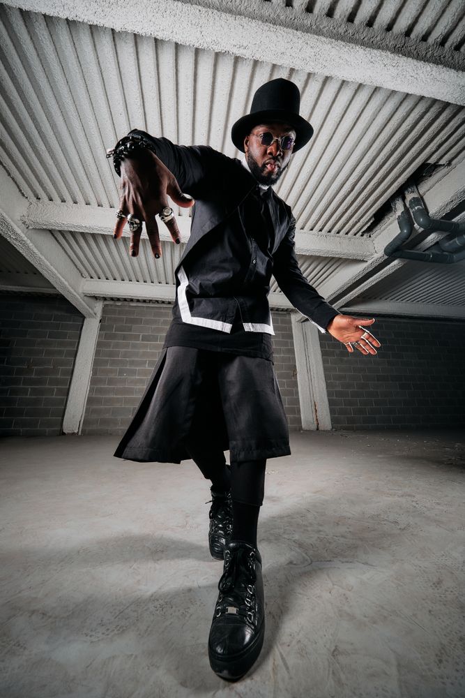 Stylish Black man dancing in garage