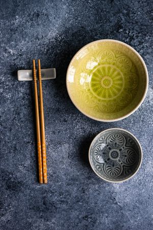Top view of two elegant bowls with chopsticks