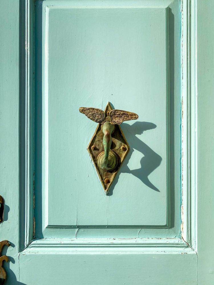 Patmian knocker close up of winged leg