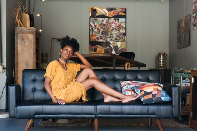 Black woman sitting on couch