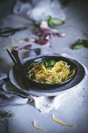 Delicious noodles served with green and vegetable