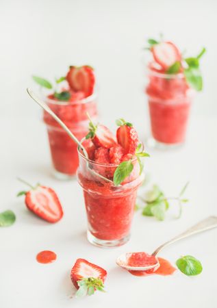 Refreshing summer drink with strawberries and mint garnish