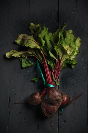Bunch of raw beetroot with edible taproots and leaves