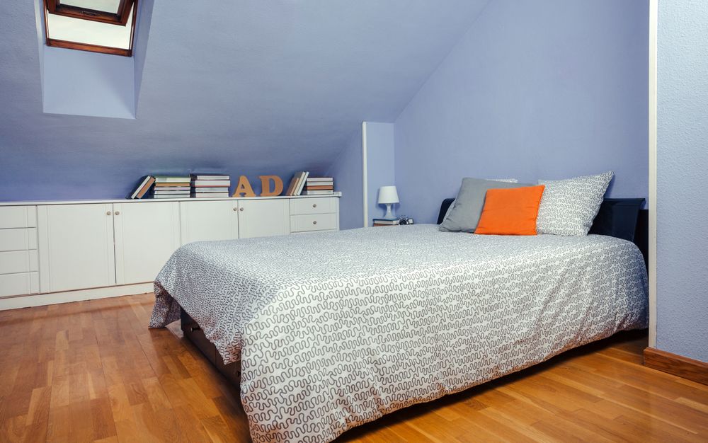 Tidy bedroom in an attic with double bed