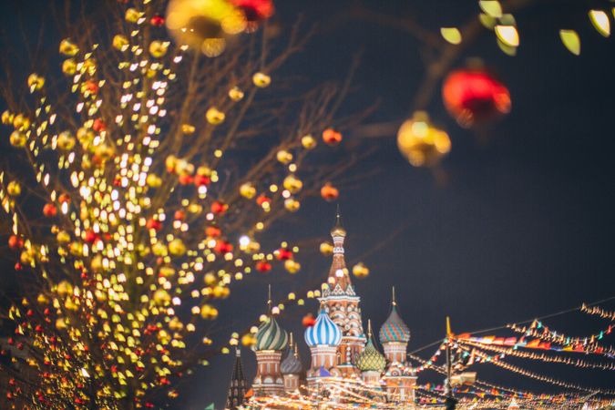 Lit Christmas decoration near St. Basil's Cathedral in Moscow, Russia at night