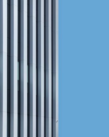 Side view of striped building under blue sky