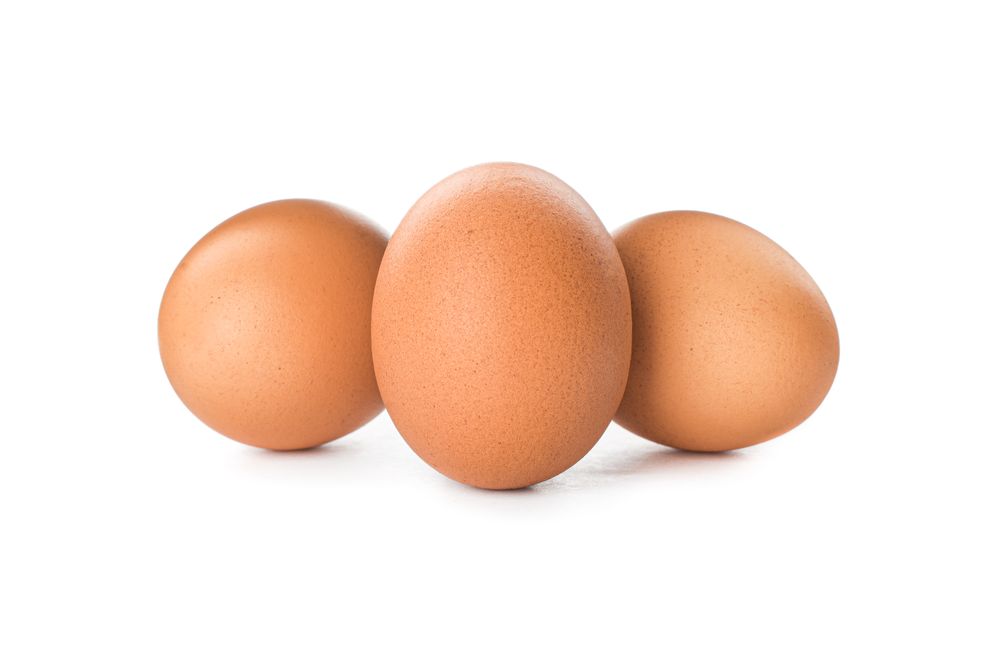 Brown chicken eggs isolated on plain background