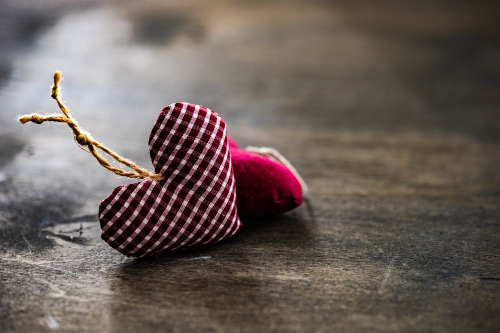 Valentine's day concept of thatched heart decorations on wooden table