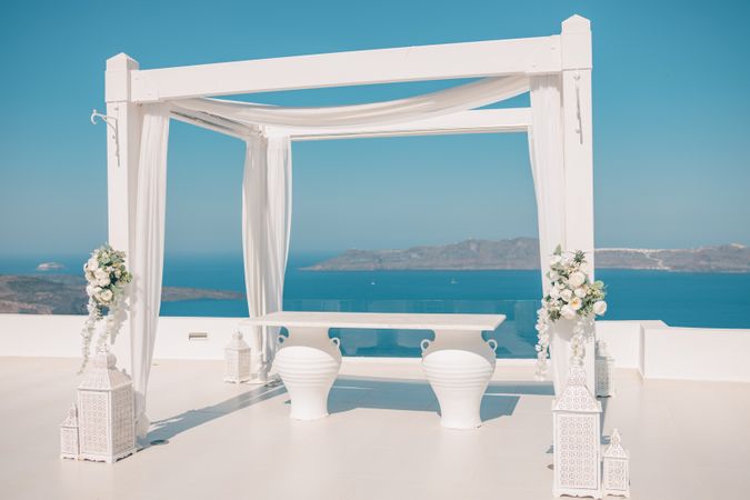 Canopy on a patio in Santorini with views of the sea below