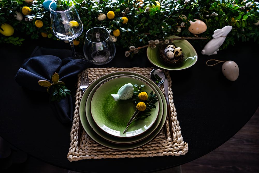 Top view of decorative ceramic bird on plate for spring table setting