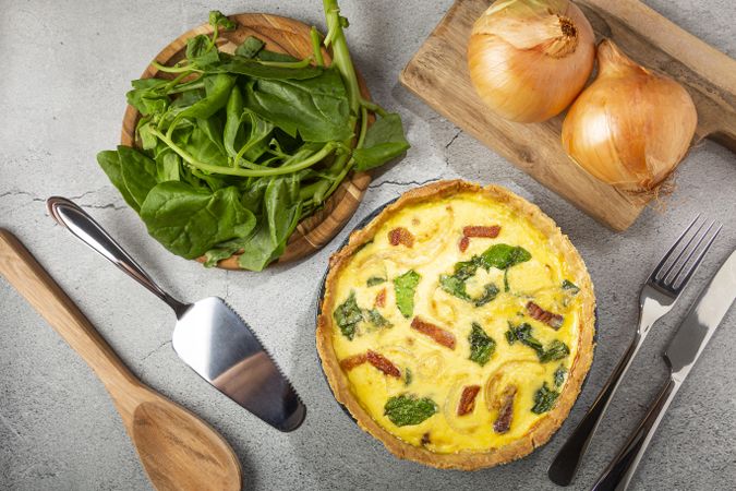 Spinach quiche with onion and bacon.