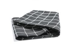 Folded fabric napkin isolated on plain background