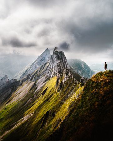 Man standing near Segla summit in Senja island, Norway