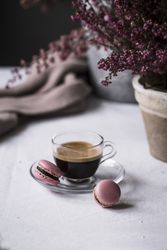 Cup of espresso with macaroons