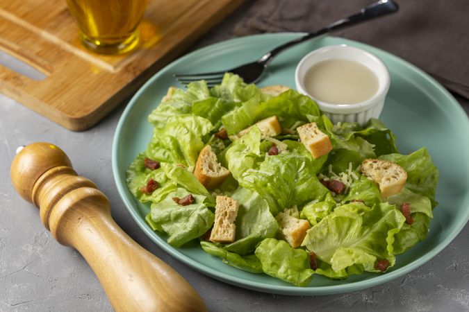 Caesar salad with croutons and bacon.