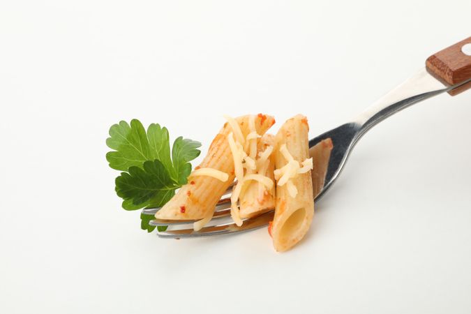 Fork with tasty pasta isolated on blank background