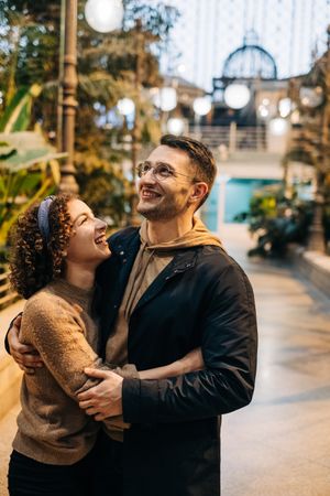 Happy couple hugging in pavilion