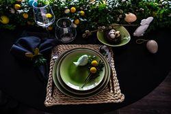 Top view of decorative ceramic bird on plate for spring table setting