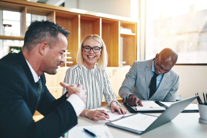 Group of happy people working together in an office