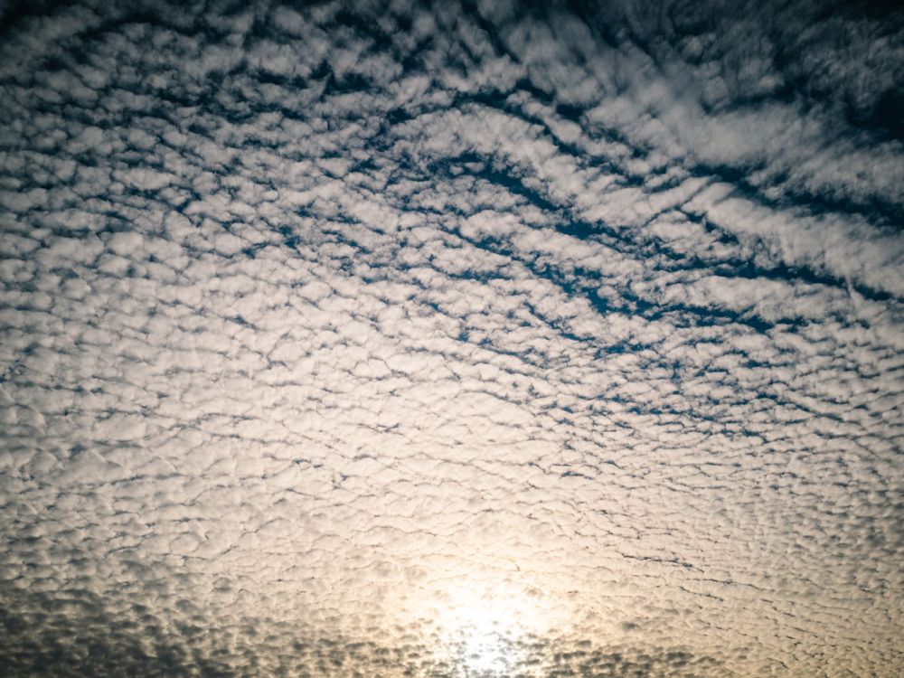 Picturesque cloudy sky at sundown