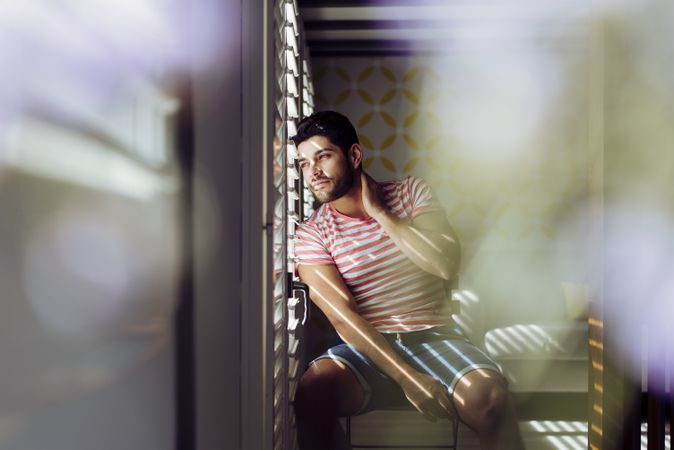 Young confident man looking away