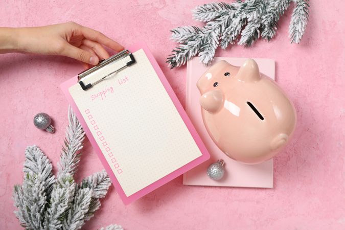 Concept of Christmas finance with piggy bank, top view