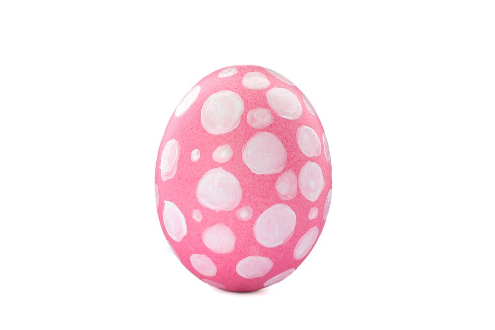 Decorative Easter egg isolated on light background. Festive tradition