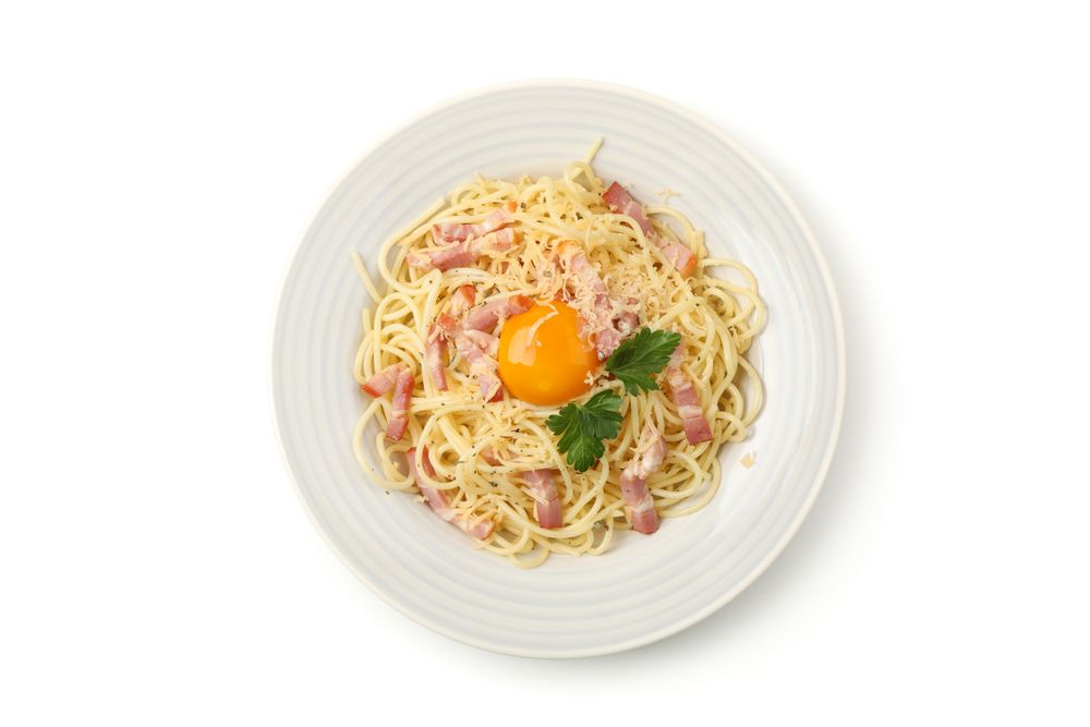 Plate with tasty pasta isolated on plain background