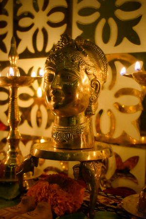 Gold buddha figurine on table