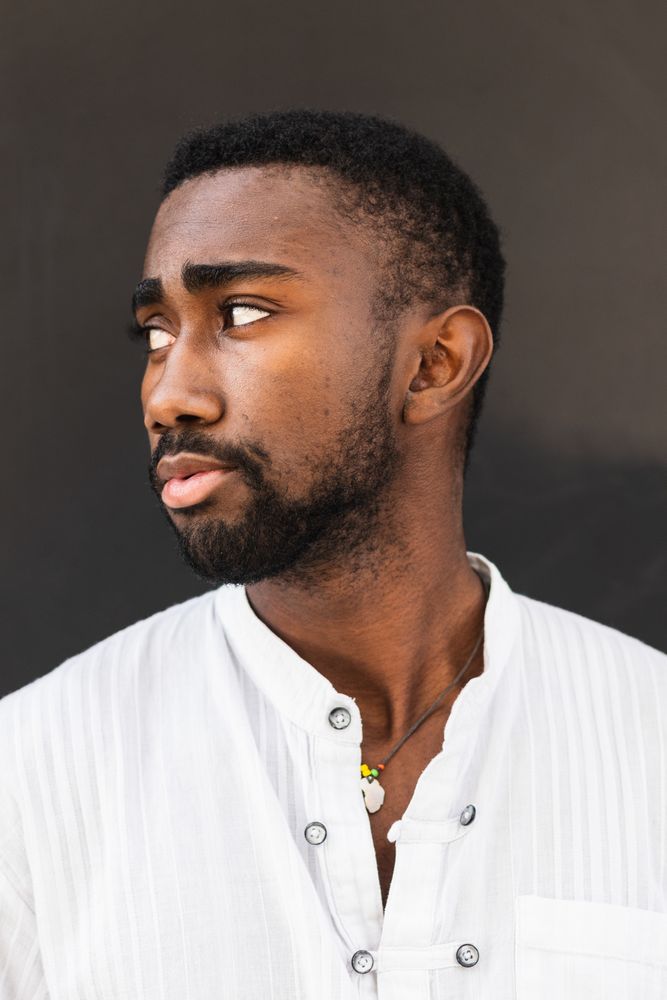 Black man in trendy clothes in city