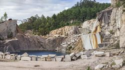 Calm water near stone quarry