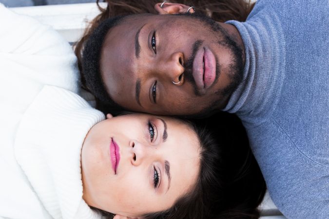 Loving multiethnic couple resting together