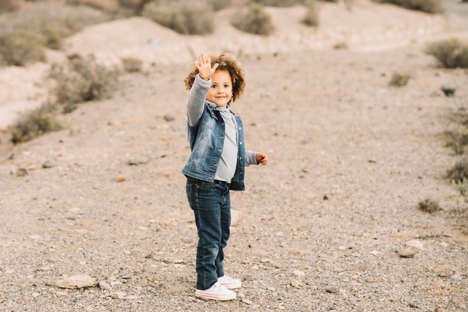 curly toddler on nature