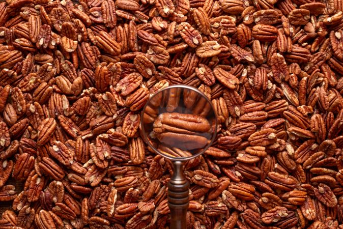 Pecan nuts pile, above view, full frame background
