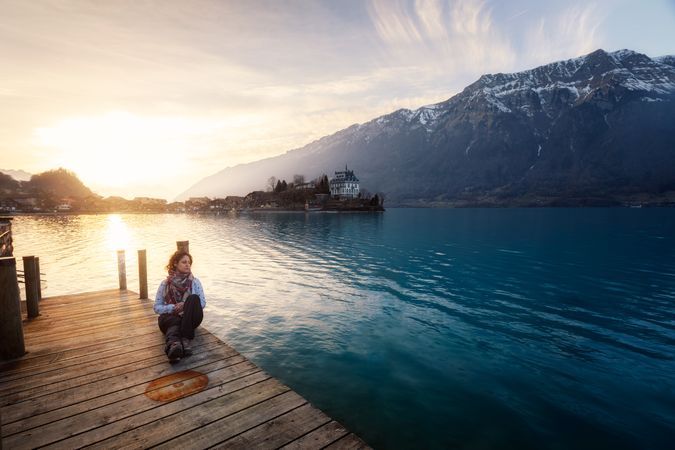 woman on pier in mountains