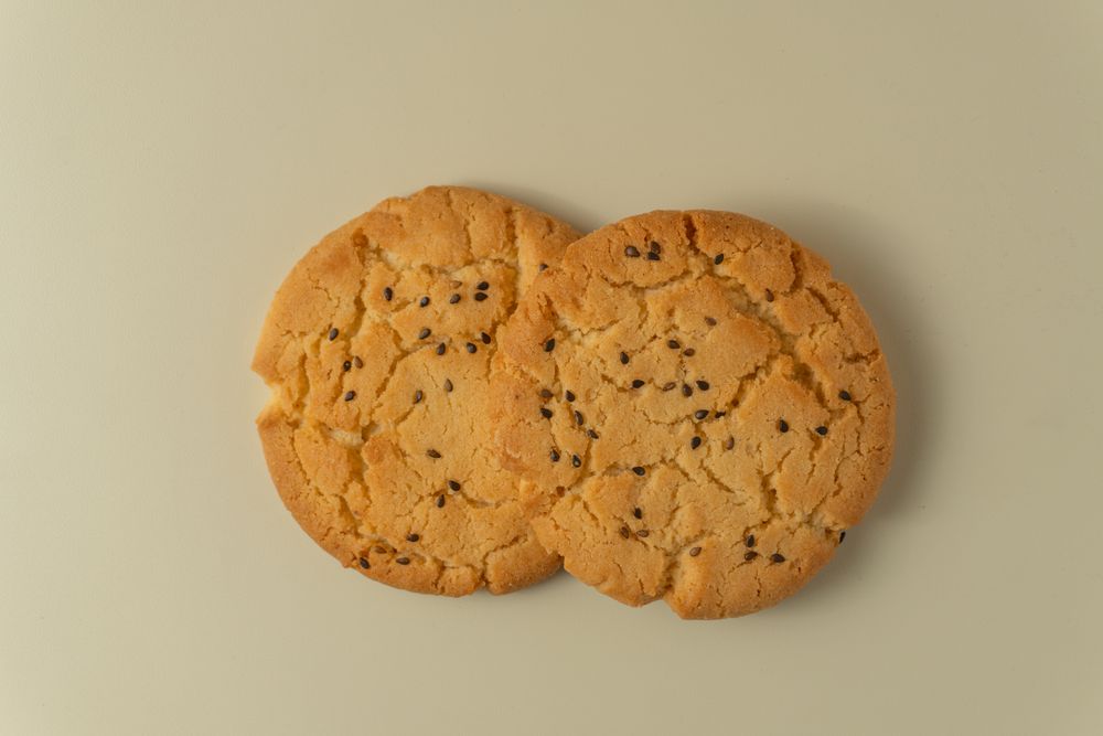Sesame topped cookies arranged neatly