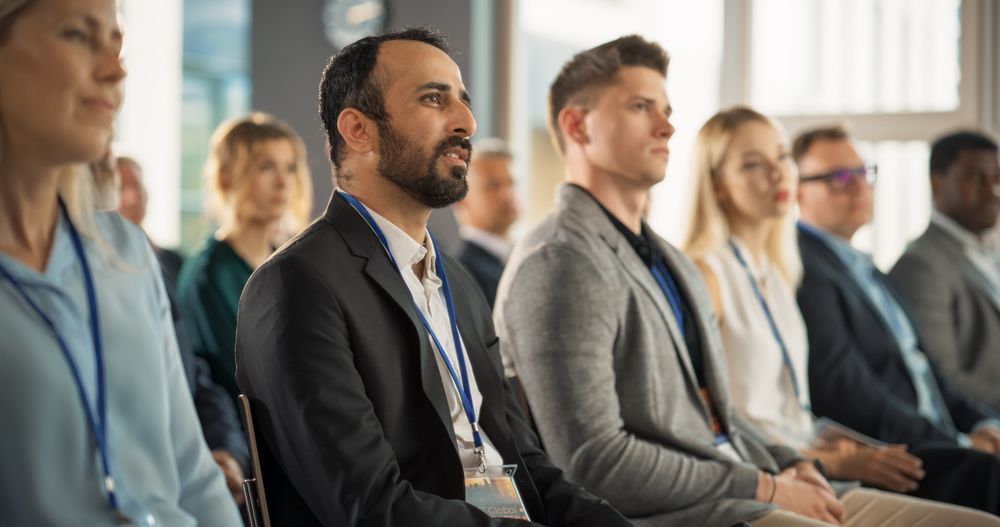 Middle Eastern Man Looking For Investment Opportunities At International Tech Forum