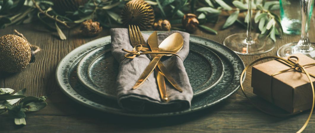 Holiday party table setting with festive decoration and small box