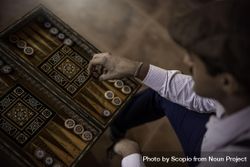 Man playing backgammon 5r7X24