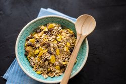 Top view of hearty bowl of oatmeal with raisins
