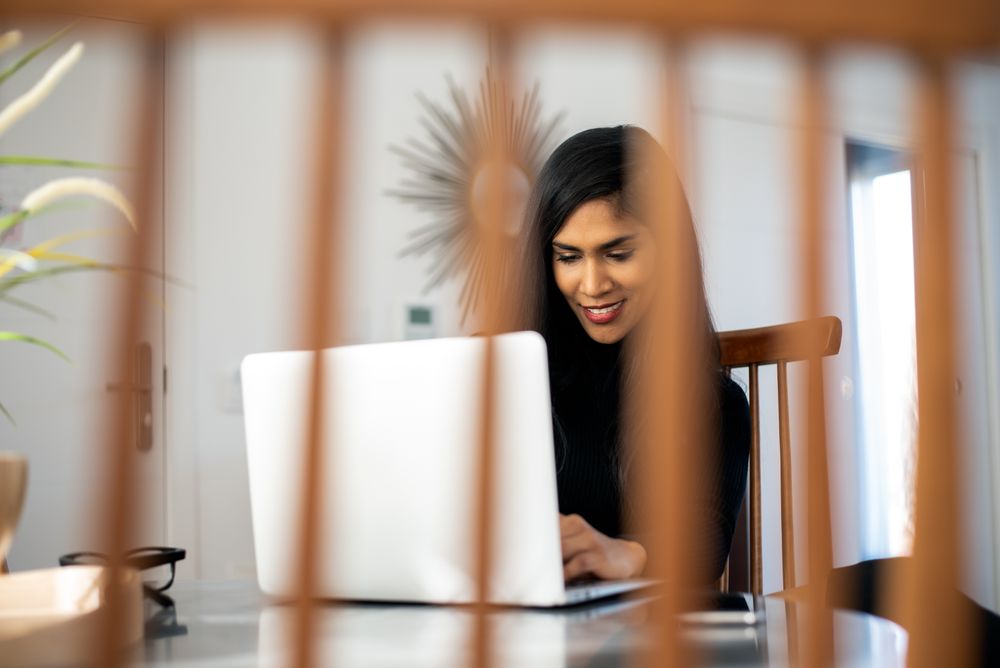 Businesswoman working from home on her computer