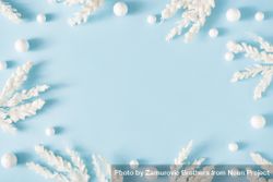 Snowy Christmas tree branches on pastel blue background 5opz84